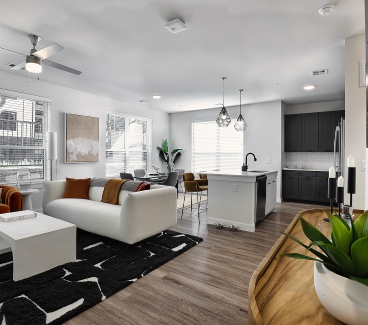 living area that includes ample seating spaces and bright lighting